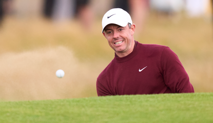 Rory McIlroy hits a bunker shot 