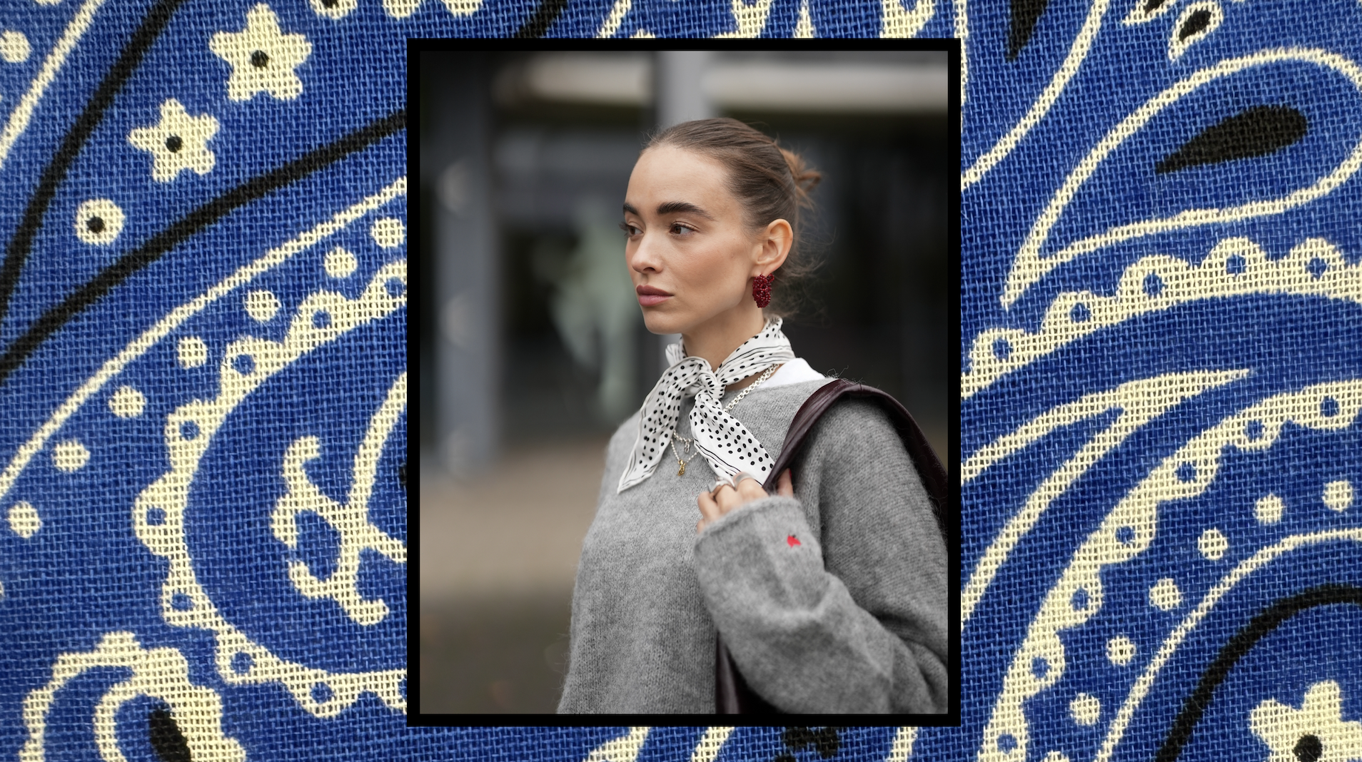 Bandana print background with a photo of a woman wearing a silk bandana and a gray sweater