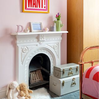 pink girls bedroom with fireplace