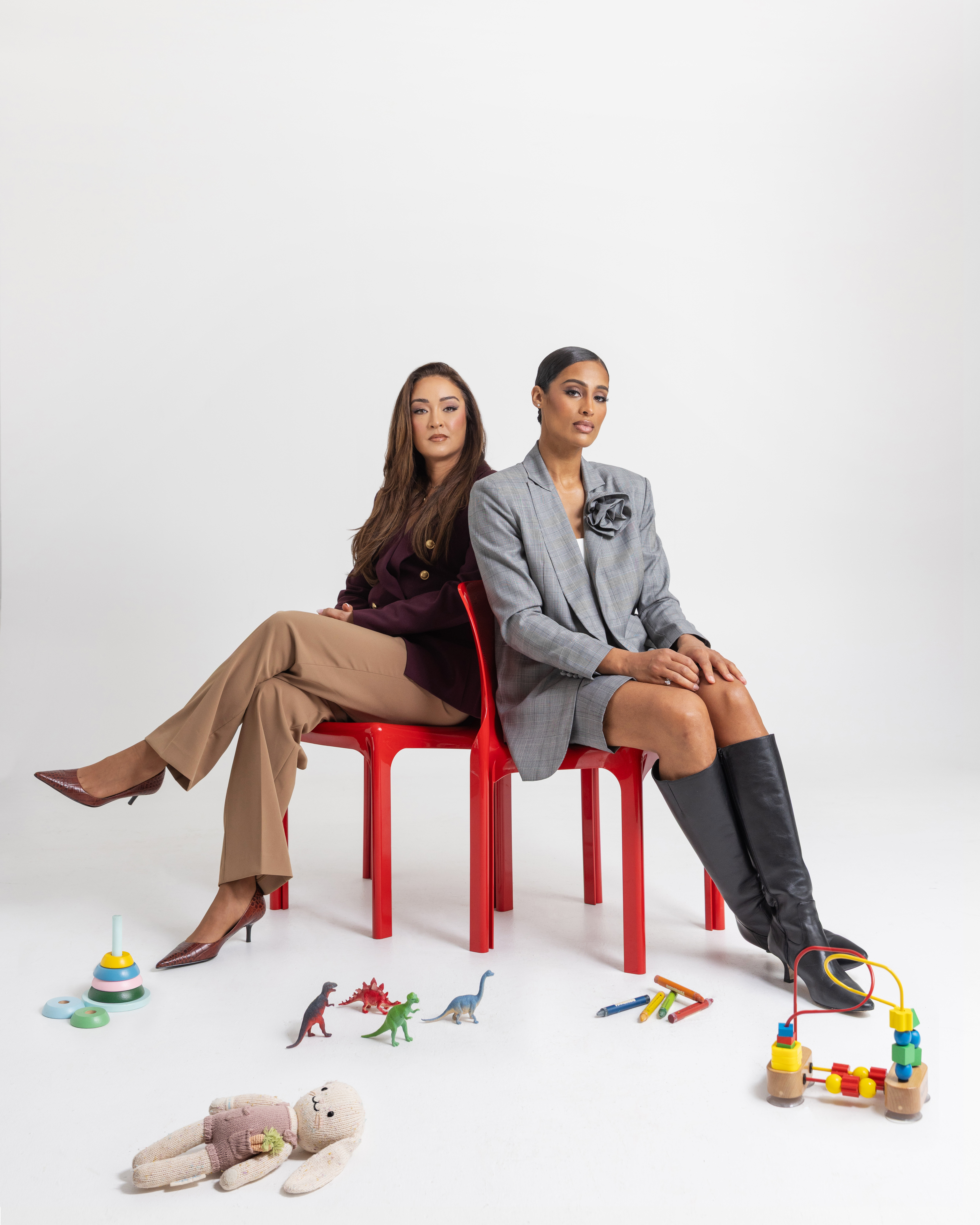 WNBA superstar Skylar Diggins and sports broadcaster Cassidy Hubbarth on red chairs surrounded by kids' toys