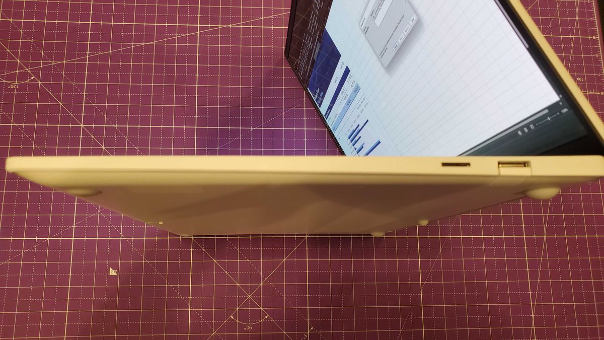 white laptop sitting on desk