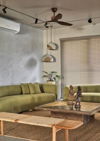 A living room with concrete lighting pieces