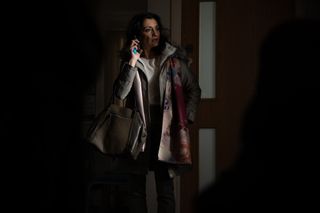 Manpreet Sharma on the phone in the dark surgery