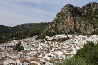 a landscape photo of the town ubrique spain where strathberry produces its bags