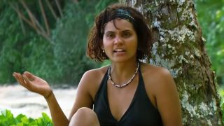 Sandra Diaz talks during a confessional on Survivor while wearing a black swimsuit. 