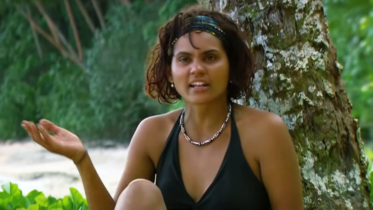 Sandra Diaz talks during a confessional on Survivor while wearing a black swimsuit. 