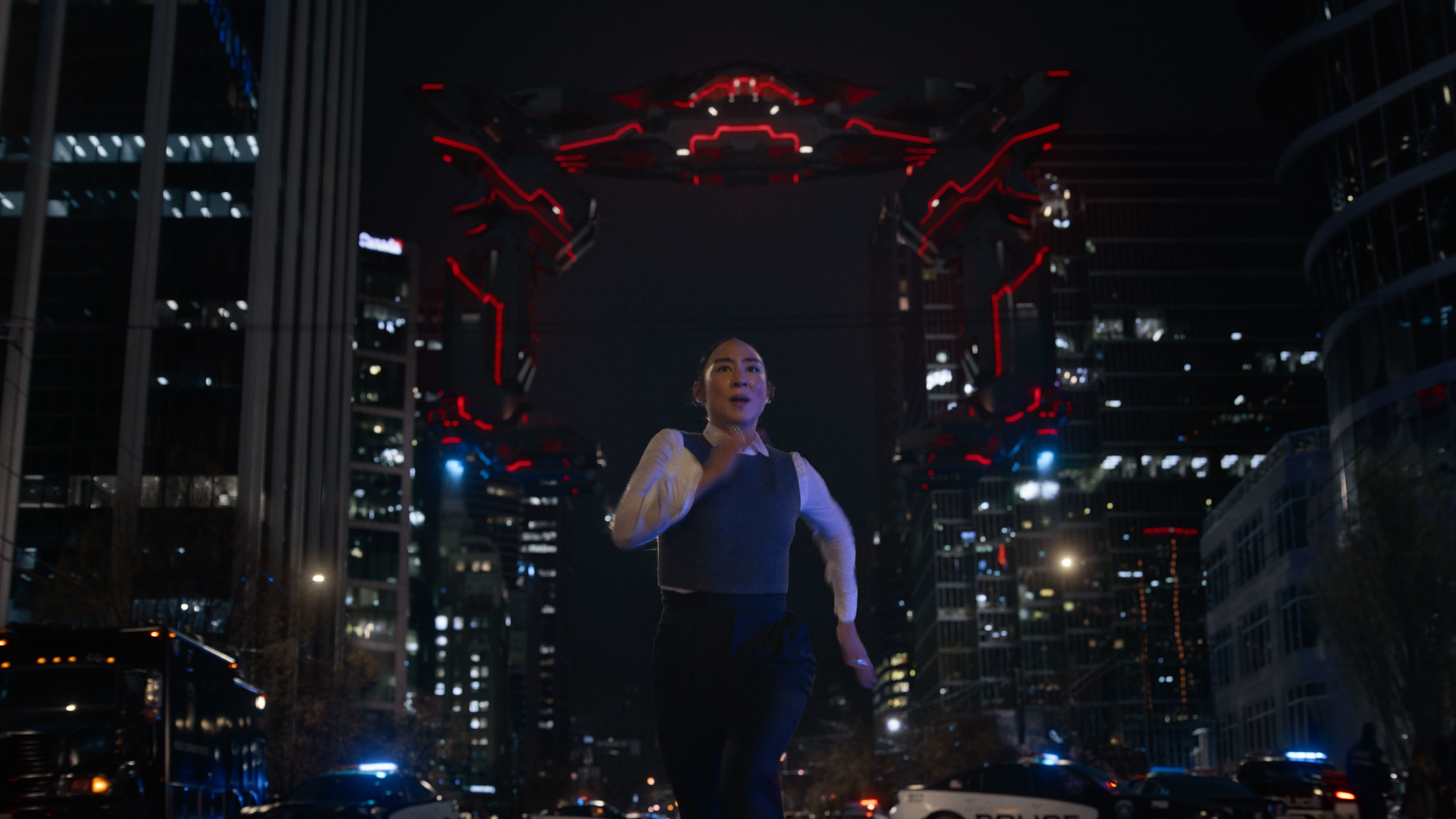 Eve Kim (Greta Lee) runs from a Recognizer in a scene from &quot;Tron: Ares&quot;