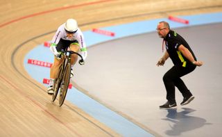 Anna Meares is cheered on by her coach in the sprint qualifiers