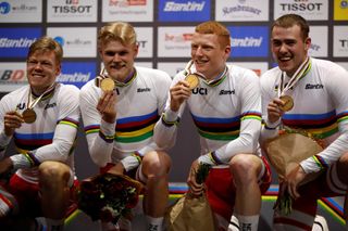 Winners Denmarks Lasse Norman Hansen Julius Johansen Frederik Rodenberg Madsen and Rasmus Pedersen pose with their medals on the podium after the mens Team Pursuit Finals at the UCI track cycling World Championship at the velodrome in Berlin on February 27 2020 Photo by Odd ANDERSEN AFP Photo by ODD ANDERSENAFP via Getty Images