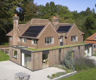 a large home with pitched roof extension in a large two storey detached home