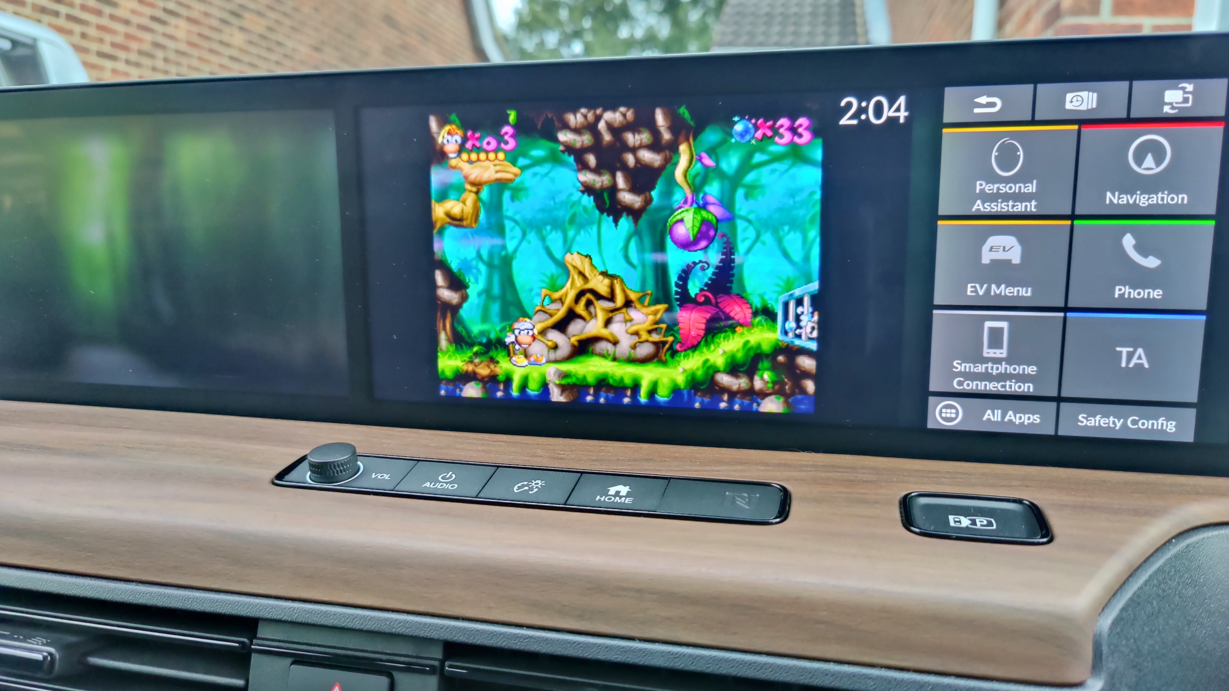 Rayman on screen in the Honda e