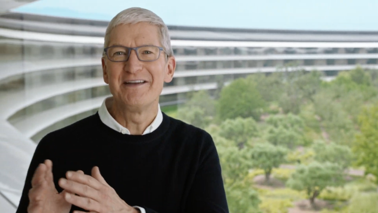 Apple event 2022 Tim Cook standing in front of a window at Apple Park