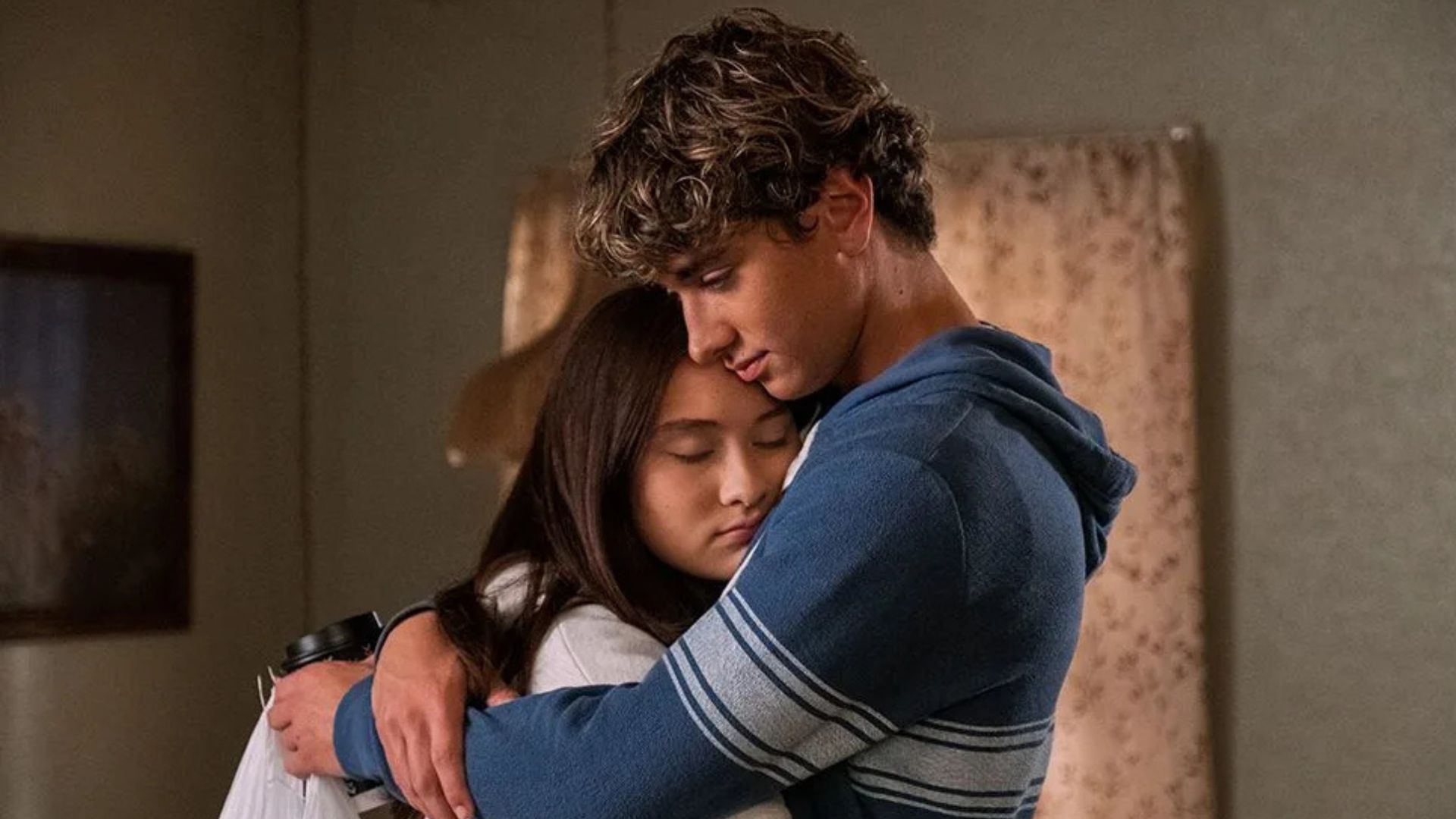 Gavin Casalegno embraces Lola Tung as she leans into him