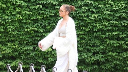 Jennifer Lopez is photographed walking in the Hamptons wearing a cloud knit cardigan and matching sweatpants