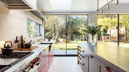 modern red kitchen extension with slimline sliding doors