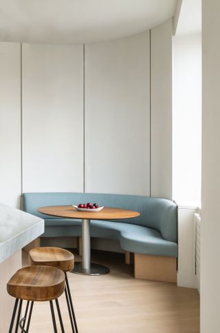 modern banquette with blue bench in a minimalist kitchen