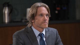 Adam J. Harrington as John Cates in a suit in General Hospital