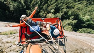 Two big wall climbers relax on a portaledge high up in Squamish