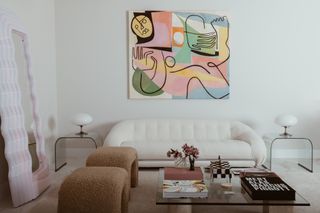 A living room full of organic shapes and a pale color scheme