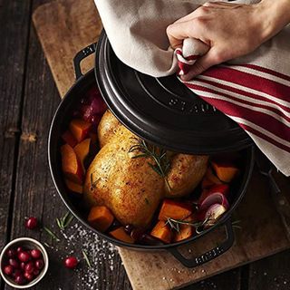 STAUB 22cm matt black cast iron cocotte with roasted chicken and vegetables