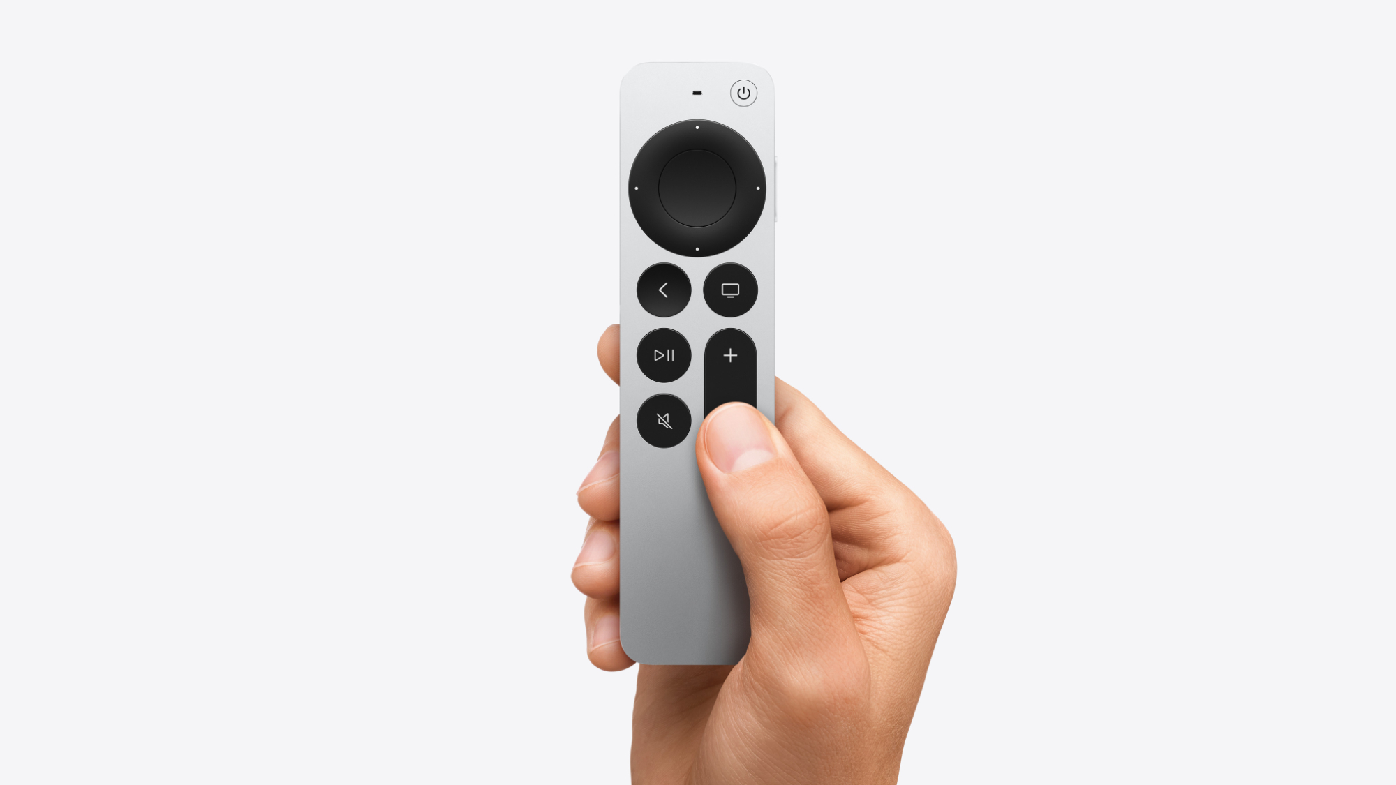 Apple TV 4K in hand on a white background