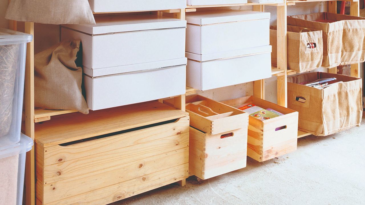 A garage with storage on wooden shelves 