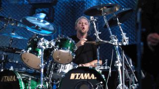 Lars Ulrich playing drums onstage in 2003