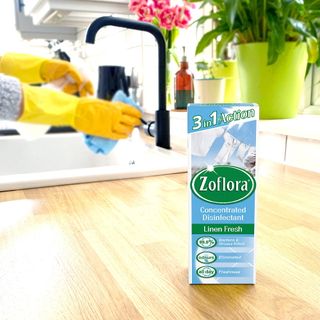wash basin wooden countertop and zoflora disinfectant