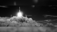 A rocket takes off in black and white infrared. 