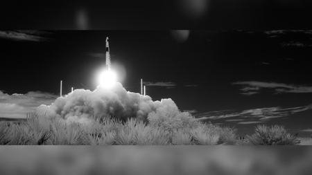 A rocket takes off in black and white infrared. 