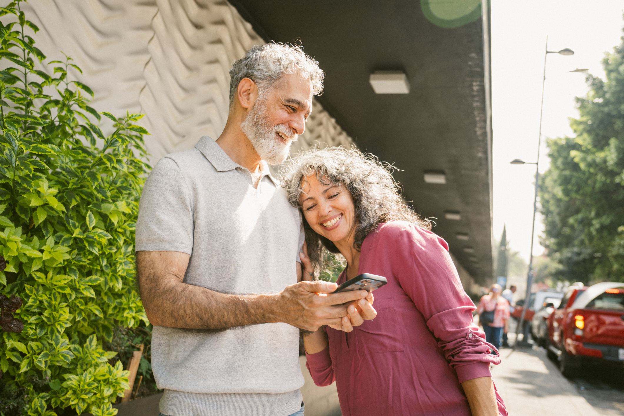 Mature Couple finding their way with the help of a smartphone
