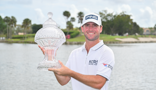 Austin Eckroat holds the Cognizant Classic trophy