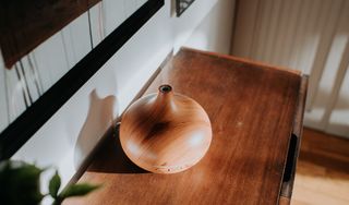 An oil diffuser standing on a table