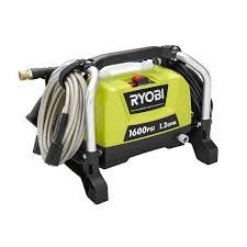 A green and black corded pressure washer