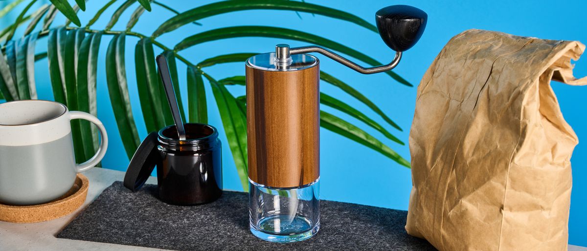 the comandante c40 mk4 hand coffee grinder with a glass catch chamber and high nitrogen steel burrs