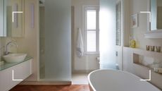 White neutral modern bathroom with large bath and walk in shower to support an expert reveal of the bathroom sounds you should never ignore