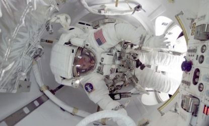 An astronaut on the International Space Station: While stays aboard the ISS are capped at six months, such long space travel can do permanent damage to cosmonauts. 