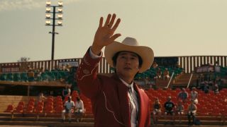 Steven Yeun as Ricky in Nope looking at UFO