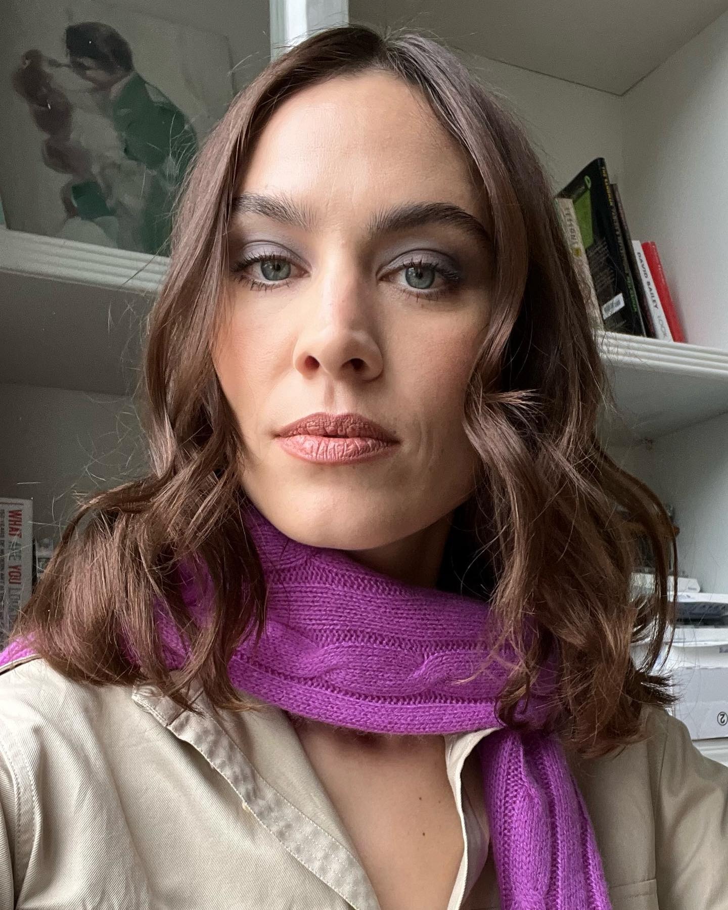 A selfie of Alexa Chung wearing a purple scarf with a dark smoky eye