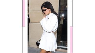 Kylie Jenner pictured wearing a white pleated skirt and matching top