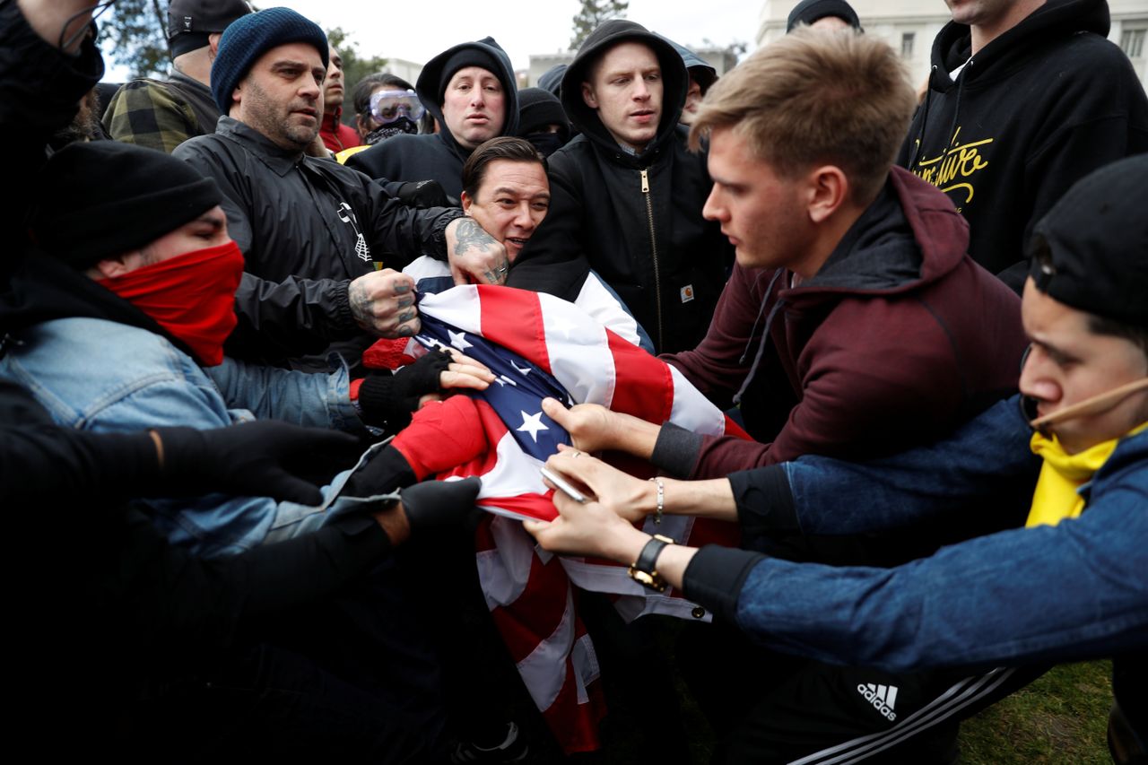 Trump supporters and anti-Trump demonstrators clash. 