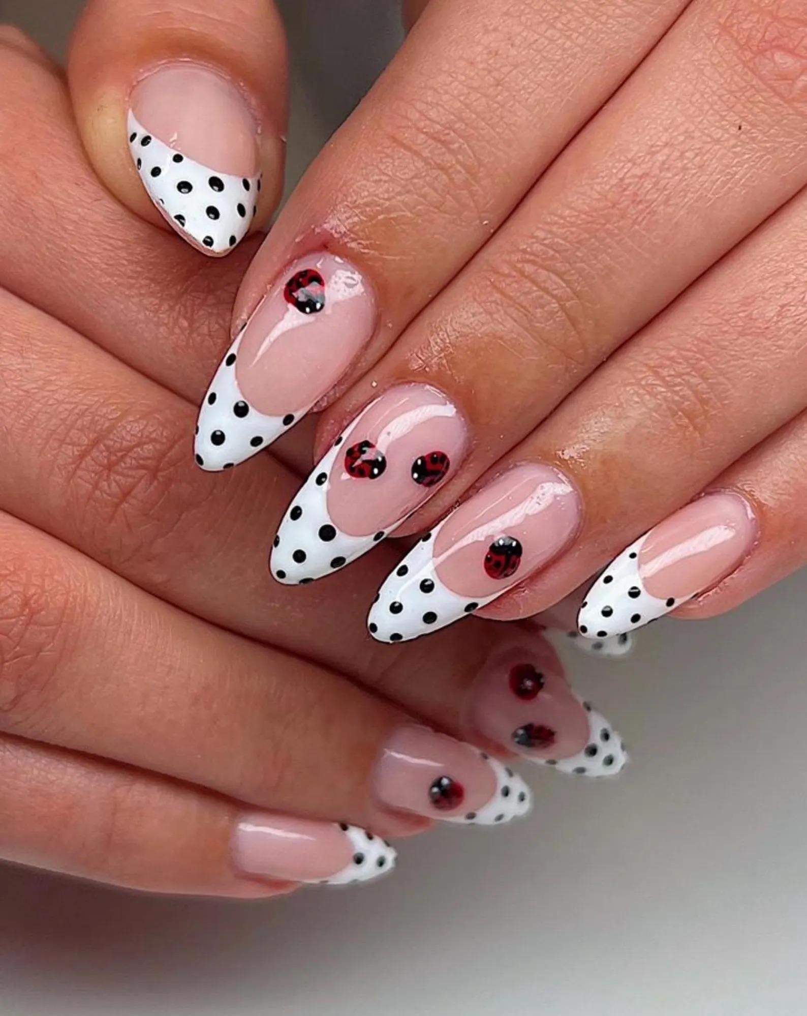 black and white polka dot nails with lady bugs