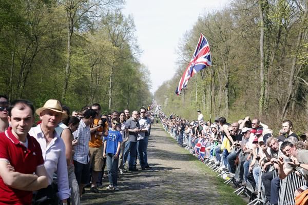 Huge crowds in the Arenberg Forest await the Paris-Roubaix peloton.