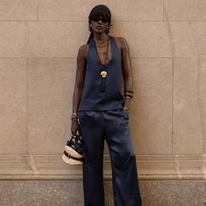 Amy wearing a navy satin set.