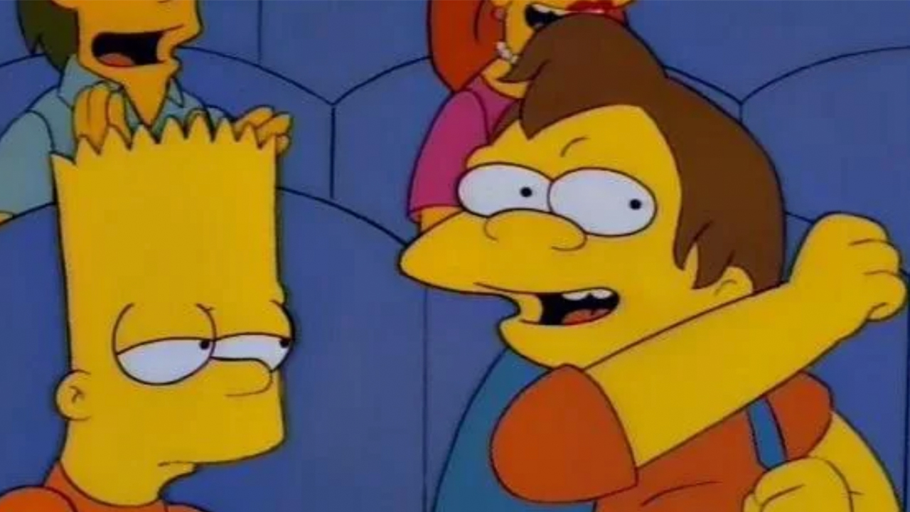 Nelson pumping his fist in a theater with Bart looking bored in The Simpsons.