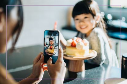 adult taking photo of child