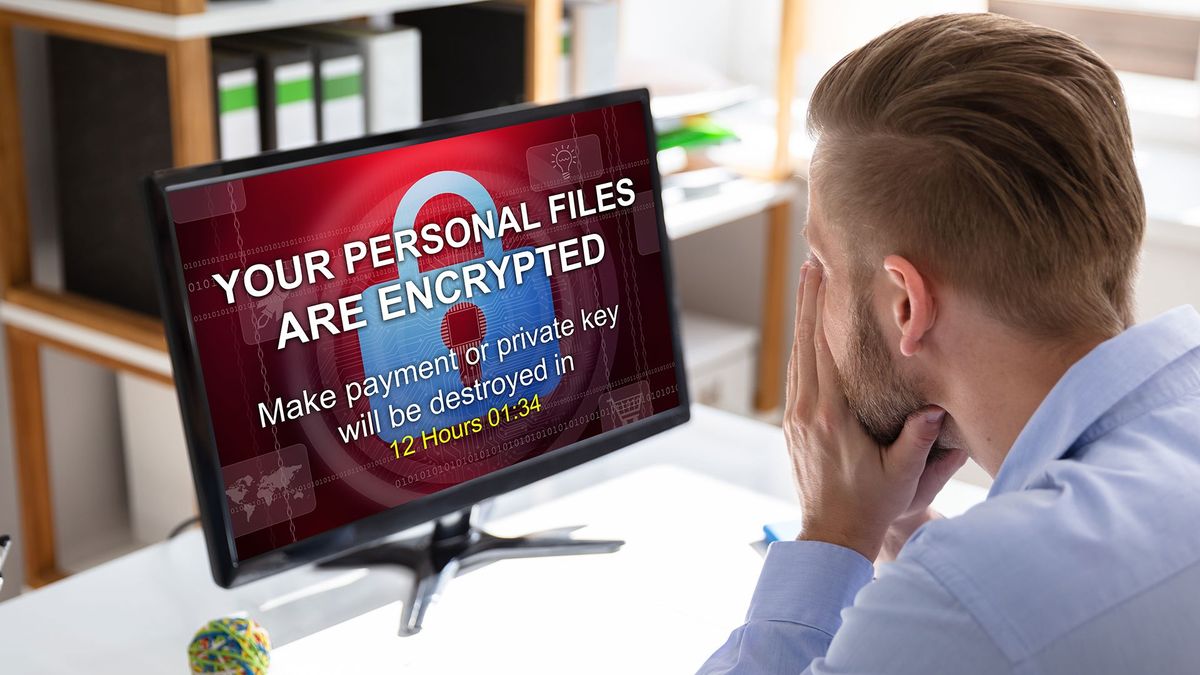 Man looking at a locked computer