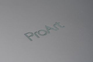 A grey ASUS ProArt Studiobook OLED sitting on a desk