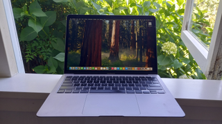 MacBook Air (2020) on a windowsill overlooking a garden