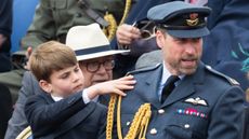 Prince Louis touches Prince William's shoulder during the military procession to mark the 80th anniversary of VE Day on May 05, 2025